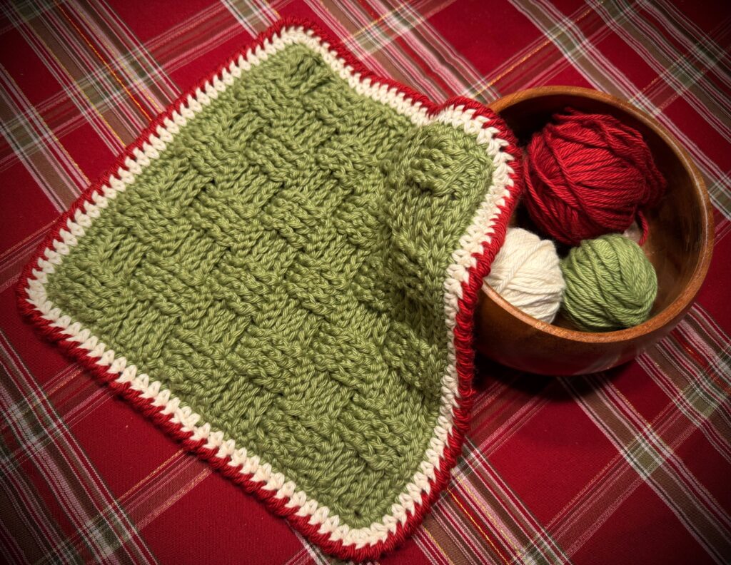 Stacked crochet dishcloths featuring the basket weave stitch, perfect for kitchen use or gifting.