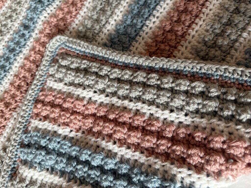 This easy to make Triple Play Crochet Blanket has a unique texture created by the combination of single and triple crochet stitches. 